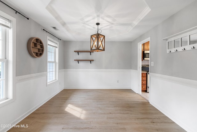 225 Woodshire Dr, Lillington, NC 27546 - unfurnished dining area with light wood-type flooring and a chandelier