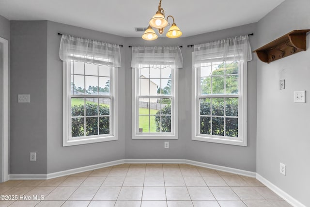 225 Woodshire Dr, Lillington, NC 27546 - unfurnished dining area featuring light tile patterned flooring and baseboards