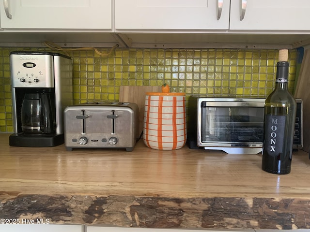 606 Ivey Cir, Wilmington, NC 28401 - kitchen view of tasteful backsplash and white cabinetry