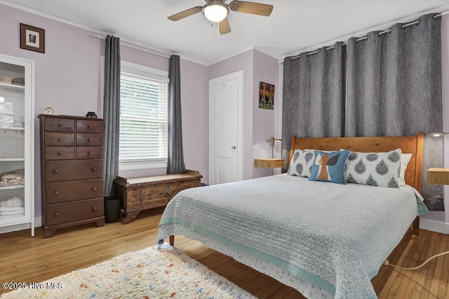 606 Ivey Cir, Wilmington, NC 28401 - bedroom featuring ornamental molding, wood finished floors, and a ceiling fan