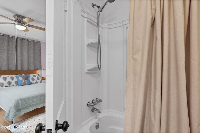 606 Ivey Cir, Wilmington, NC 28401 - ensuite bathroom featuring shower / bath combo with shower curtain and ceiling fan