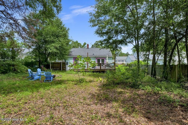 606 Ivey Cir, Wilmington, NC 28401 - view of yard featuring a wooden deck and french doors