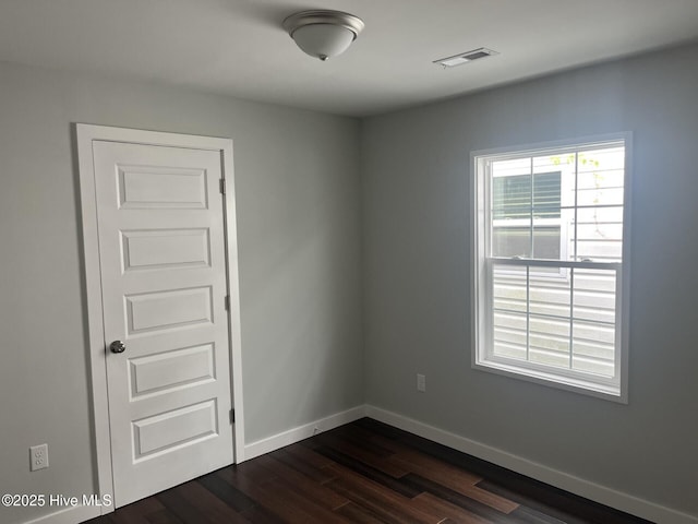 832 Fanning St, Wilmington, NC 28401 - empty room with dark wood-style floors and baseboards