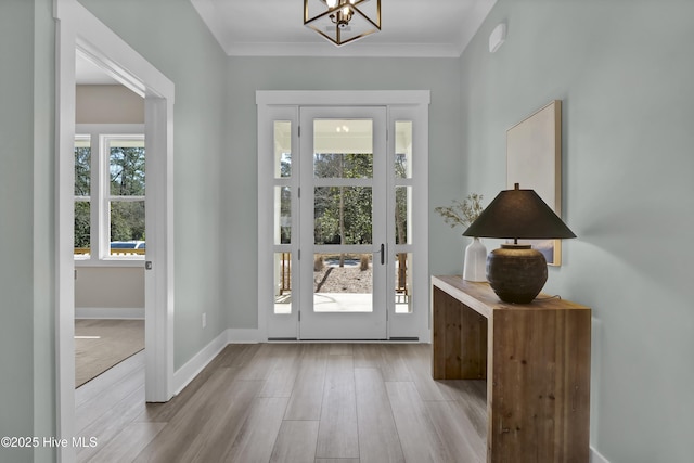 121 S Branch Rd, Wilmington, NC 28411 - entryway with a chandelier, wood finished floors, and ornamental molding