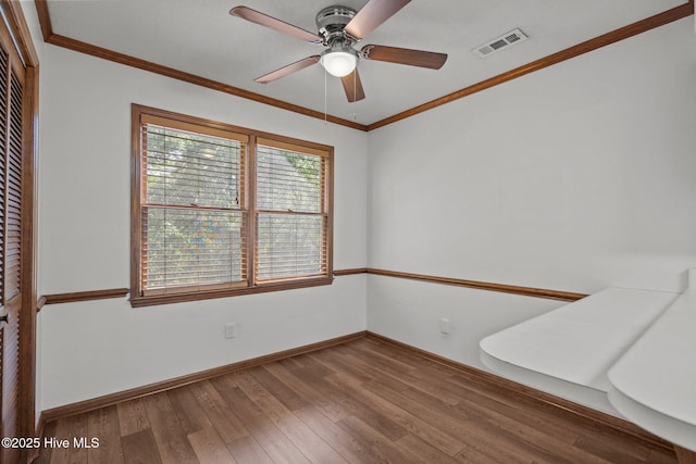 2544 Blake Trl, Wilmington, NC 28409 - empty room featuring wood finished floors, ceiling fan, and crown molding