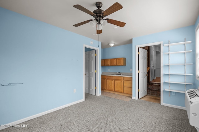 2544 Blake Trl, Wilmington, NC 28409 - unfurnished bedroom with light colored carpet, connected bathroom, and ceiling fan