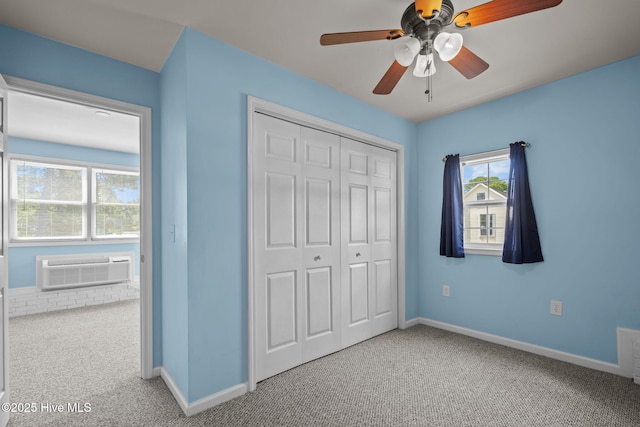 2544 Blake Trl, Wilmington, NC 28409 - unfurnished bedroom featuring carpet, a closet, a wall mounted AC, and ceiling fan
