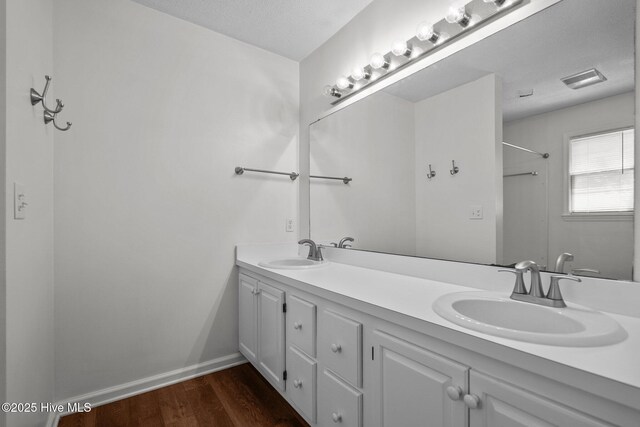2544 Blake Trl, Wilmington, NC 28409 - full bath featuring double vanity, wood finished floors, and a shower