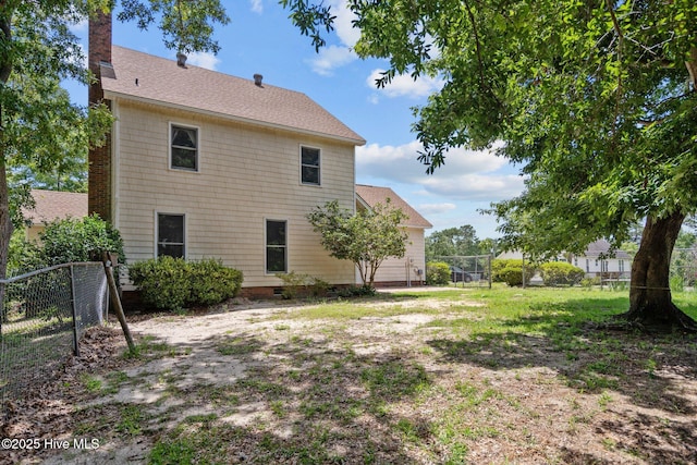 2544 Blake Trl, Wilmington, NC 28409 - rear view of house featuring a chimney and a shingled roof