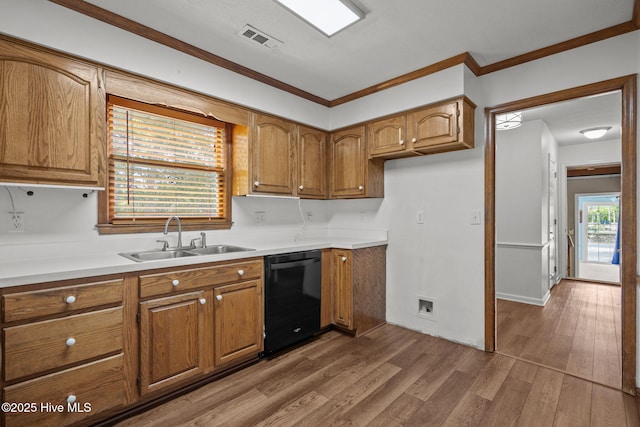 2544 Blake Trl, Wilmington, NC 28409 - kitchen featuring black dishwasher, brown cabinetry, wood finished floors, crown molding, and light countertops