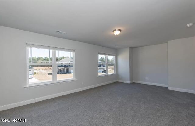5705 Sloop Ct, New Bern, NC 28560 - spare room with dark carpet and a smoke detector
