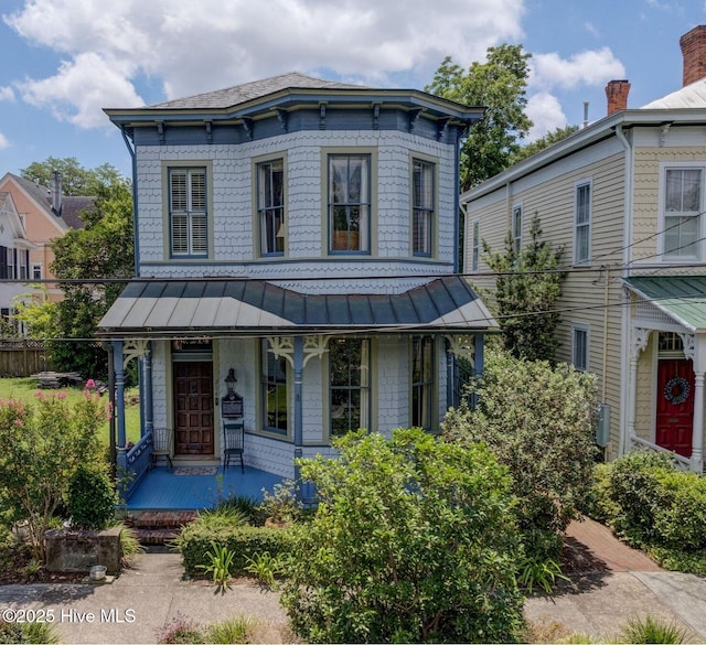 214 Nun St, Wilmington, NC 28401 - italianate house with a porch, a standing seam roof, and a metal roof