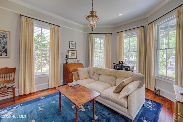 214 Nun St, Wilmington, NC 28401 - living area with wood finished floors, crown molding, and a chandelier