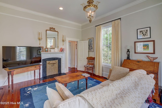214 Nun St, Wilmington, NC 28401 - living room with ornamental molding, a high end fireplace, hardwood / wood-style floors, a chandelier, and recessed lighting