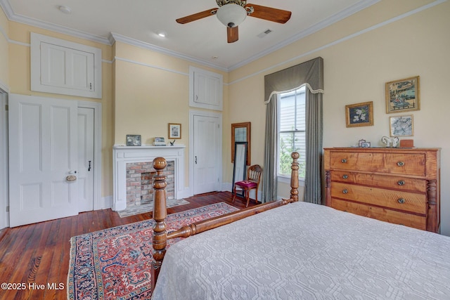 214 Nun St, Wilmington, NC 28401 - bedroom with wood finished floors, crown molding, a fireplace, ceiling fan, and recessed lighting