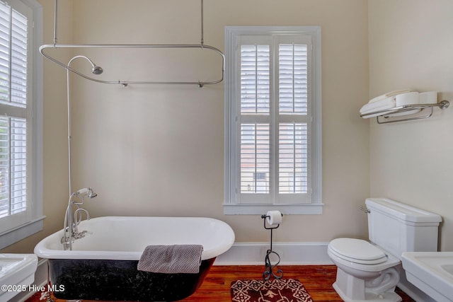 214 Nun St, Wilmington, NC 28401 - full bath with a freestanding tub and wood finished floors