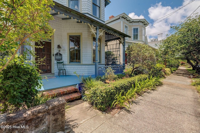 214 Nun St, Wilmington, NC 28401 - view of exterior entry with a porch