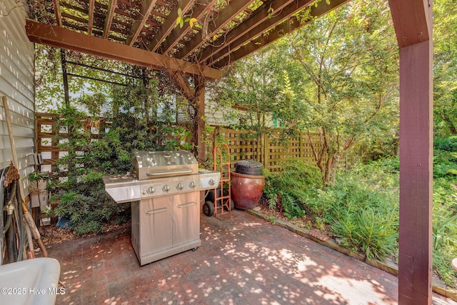 214 Nun St, Wilmington, NC 28401 - view of patio featuring grilling area and a pergola