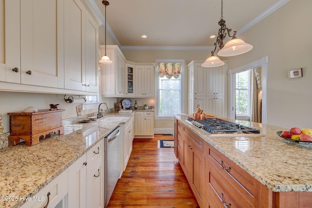 214 Nun St, Wilmington, NC 28401 - kitchen with appliances with stainless steel finishes, plenty of natural light, light wood finished floors, light stone countertops, and ornamental molding