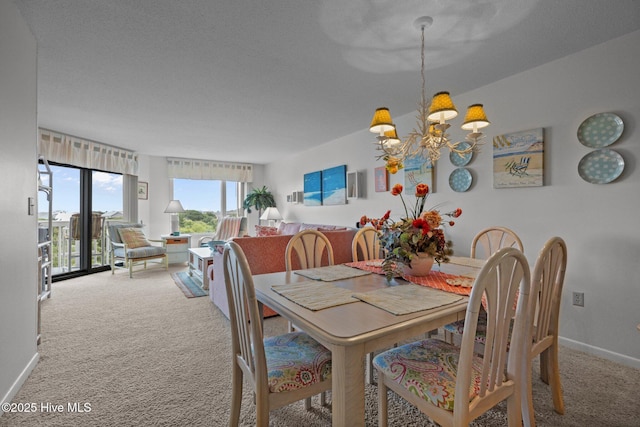 10300 Coast Guard Rd Unit E206Point, Emerald Villas, Emerald Isle, NC 28594 - carpeted dining room featuring a chandelier and baseboards