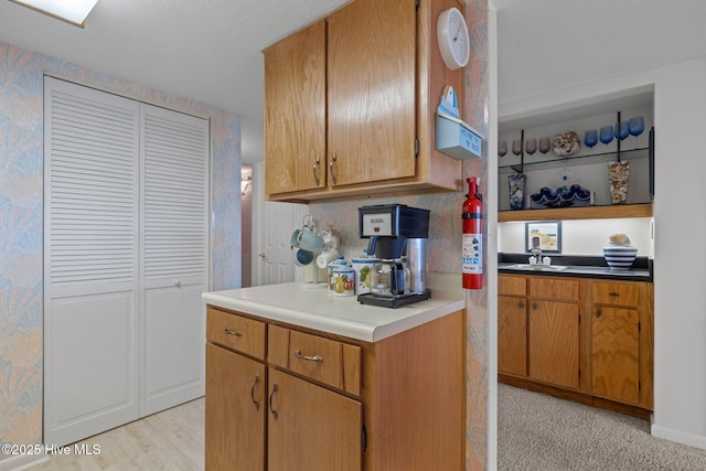10300 Coast Guard Rd Unit E206Point, Emerald Villas, Emerald Isle, NC 28594 - kitchen featuring a textured ceiling, brown cabinets, and open shelves