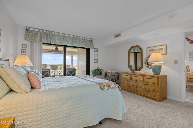 10300 Coast Guard Rd Unit E206Point, Emerald Villas, Emerald Isle, NC 28594 - bedroom featuring access to exterior and light carpet