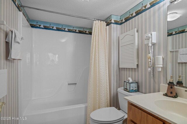 10300 Coast Guard Rd Unit E206Point, Emerald Villas, Emerald Isle, NC 28594 - full bathroom featuring wallpapered walls, shower / tub combo with curtain, vanity, and a textured ceiling