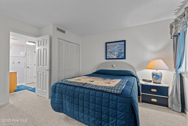 10300 Coast Guard Rd Unit E206Point, Emerald Villas, Emerald Isle, NC 28594 - bedroom with carpet flooring and a closet