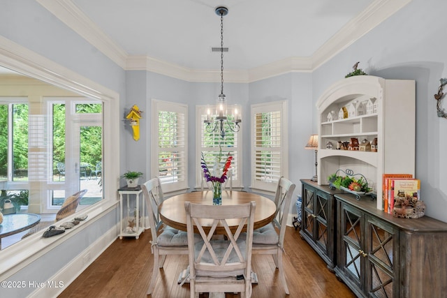 9134 Ocean Harbour Golf Club Rd SW, Calabash, NC 28467 - dining space with dark wood-style flooring, crown molding, and a chandelier