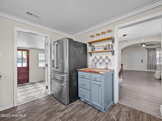 579 Hubert Blvd, Hubert, NC 28539 - kitchen featuring stainless steel fridge with ice dispenser, wooden counters, a ceiling fan, dark wood-style floors, and ornamental molding