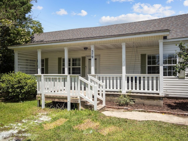 579 Hubert Blvd, Hubert, NC 28539 - view of front facade with covered porch and roof with shingles