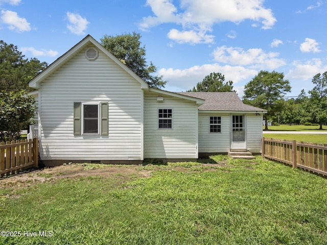 579 Hubert Blvd, Hubert, NC 28539 - rear view of house with entry steps, a fenced backyard, a shingled roof, and crawl space