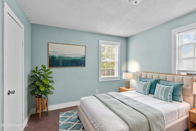 1306 Myrtle St, Greenville, NC 27834 - bedroom featuring multiple windows and a textured ceiling