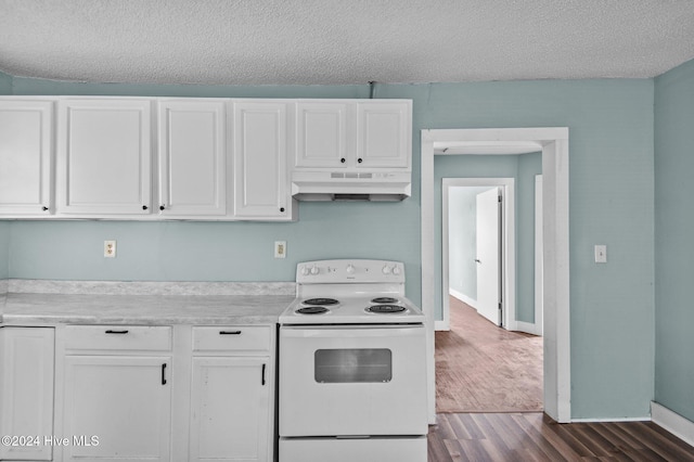 1306 Myrtle St, Greenville, NC 27834 - kitchen with white electric range oven, under cabinet range hood, white cabinetry, light countertops, and dark wood-style flooring