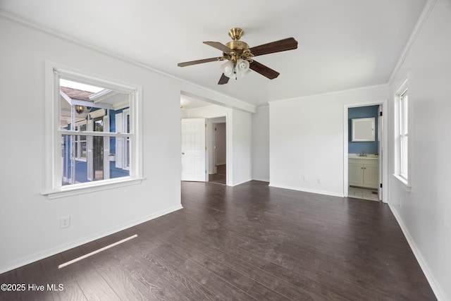 907 Woodruff Ave, Elizabeth City, NC 27909 - unfurnished living room featuring healthy amount of natural light, crown molding, wood finished floors, and a ceiling fan
