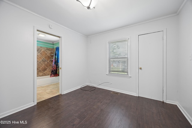 907 Woodruff Ave, Elizabeth City, NC 27909 - empty room with crown molding and wood finished floors
