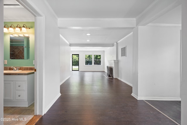 907 Woodruff Ave, Elizabeth City, NC 27909 - hall featuring dark wood-style floors, crown molding, and recessed lighting