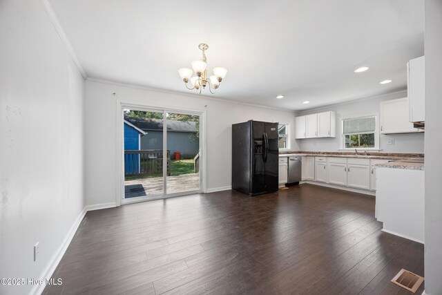 907 Woodruff Ave, Elizabeth City, NC 27909 - kitchen featuring black fridge with ice dispenser, a chandelier, stainless steel dishwasher, crown molding, and white cabinetry