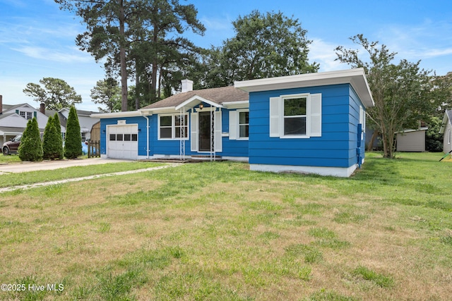 907 Woodruff Ave, Elizabeth City, NC 27909 - ranch-style house with a garage, driveway, a front yard, and a chimney