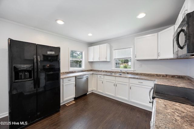 907 Woodruff Ave, Elizabeth City, NC 27909 - kitchen with black appliances, crown molding, dark wood-style floors, white cabinetry, and recessed lighting