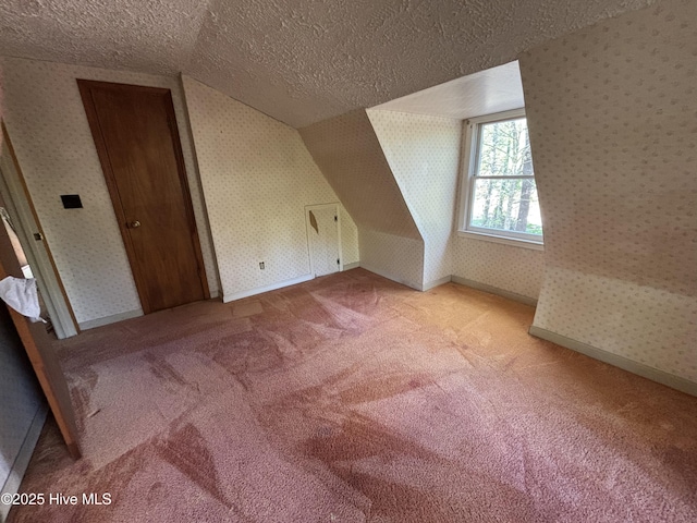 2440 Ocean Sound Cir SW, Supply, NC 28462 - additional living space featuring a textured ceiling, wallpapered walls, light carpet, and vaulted ceiling