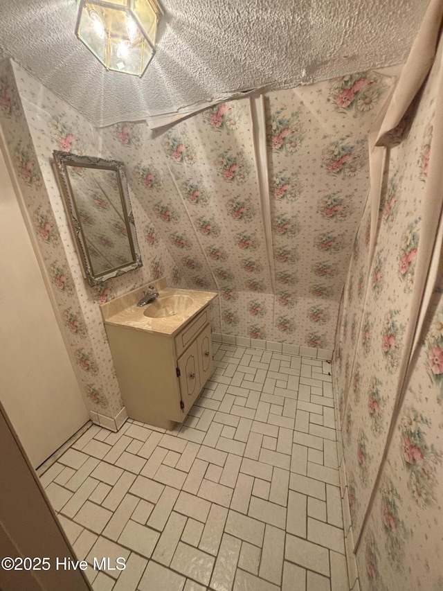 2440 Ocean Sound Cir SW, Supply, NC 28462 - bathroom featuring wallpapered walls and vanity