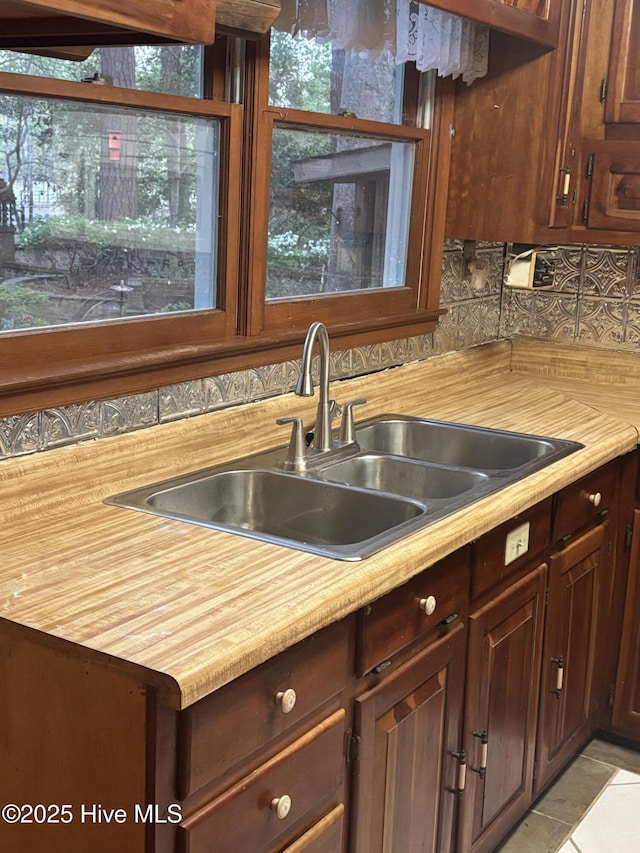 2440 Ocean Sound Cir SW, Supply, NC 28462 - kitchen featuring tasteful backsplash, wood counters, and light tile patterned flooring