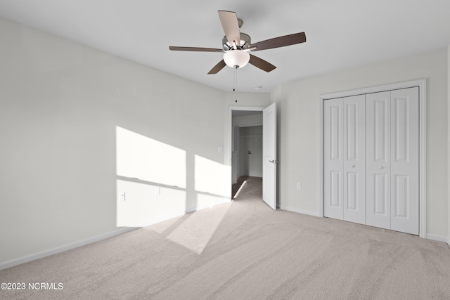 463 Sullivan Loop Rd, Midway Park, NC 28544 - unfurnished bedroom with carpet flooring, a closet, and a ceiling fan