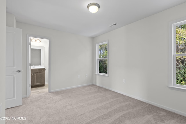 463 Sullivan Loop Rd, Midway Park, NC 28544 - unfurnished bedroom featuring light carpet and ensuite bath
