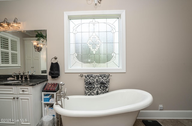 545 Gladstone Cir SW, Ocean Isle Beach, NC 28469 - full bathroom with a freestanding bath and vanity