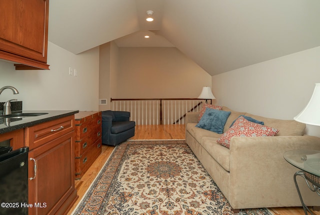 545 Gladstone Cir SW, Ocean Isle Beach, NC 28469 - living room featuring light wood-style floors, lofted ceiling, and recessed lighting