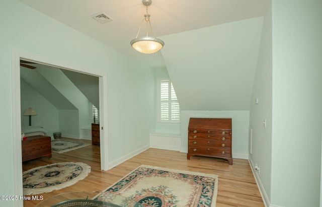 545 Gladstone Cir SW, Ocean Isle Beach, NC 28469 - bonus room featuring wood finished floors and lofted ceiling