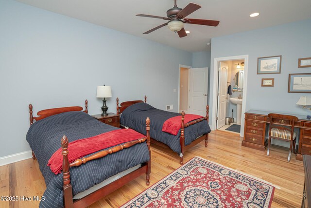 545 Gladstone Cir SW, Ocean Isle Beach, NC 28469 - bedroom featuring wood finished floors, recessed lighting, ensuite bath, and a ceiling fan