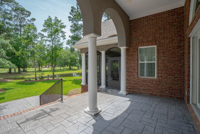 545 Gladstone Cir SW, Ocean Isle Beach, NC 28469 - view of patio with a water view